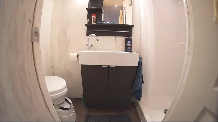 0353 DIY tiny house with clever elevator bed build by young man super cheap smallhometours.com 5