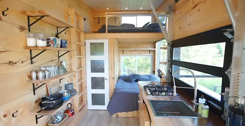 0380 Off grid tiny house with 4 solar panels dual bed design garage door window smallhometours.com 3