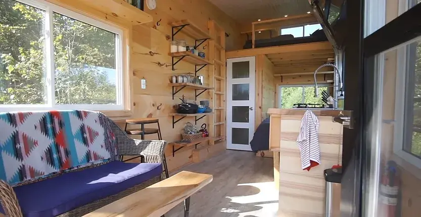 0380 Off grid tiny house with 4 solar panels dual bed design garage door window smallhometours.com 6