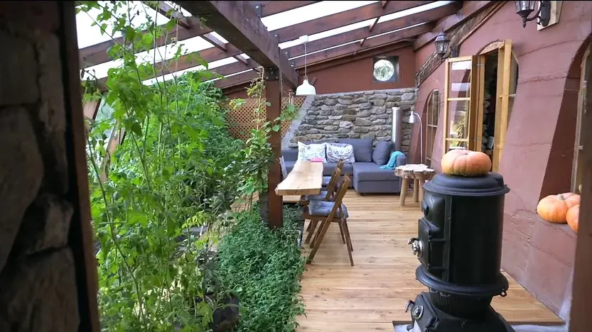 0385 Off grid homesteading family lives in a renovated stone earthship smallhometours.com 1