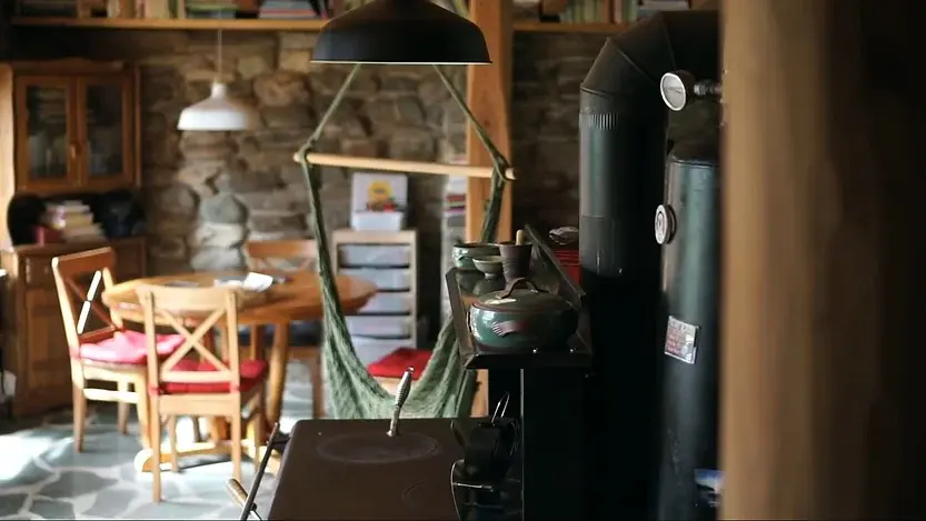 0385 Off grid homesteading family lives in a renovated stone earthship smallhometours.com 3