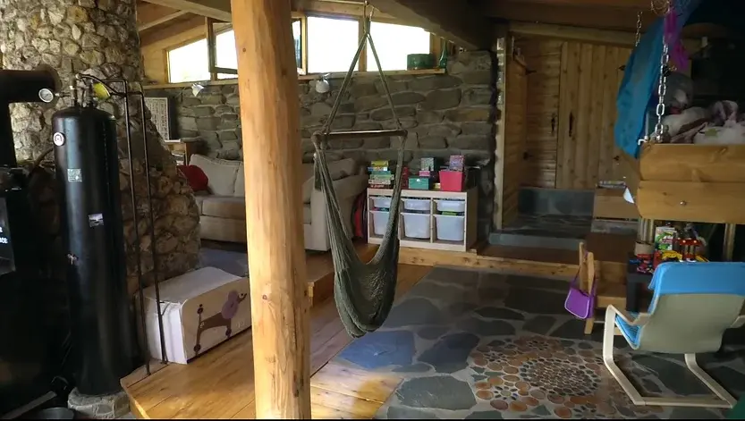 0385 Off grid homesteading family lives in a renovated stone earthship smallhometours.com 4