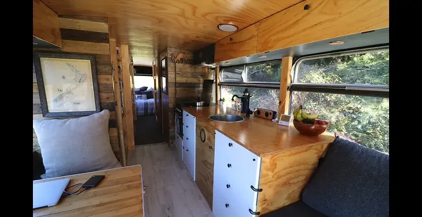 0397 This inspiring couple quit their 9 5 jobs to live travel in a DIY off grid school bus conversion smallhometours.com 2