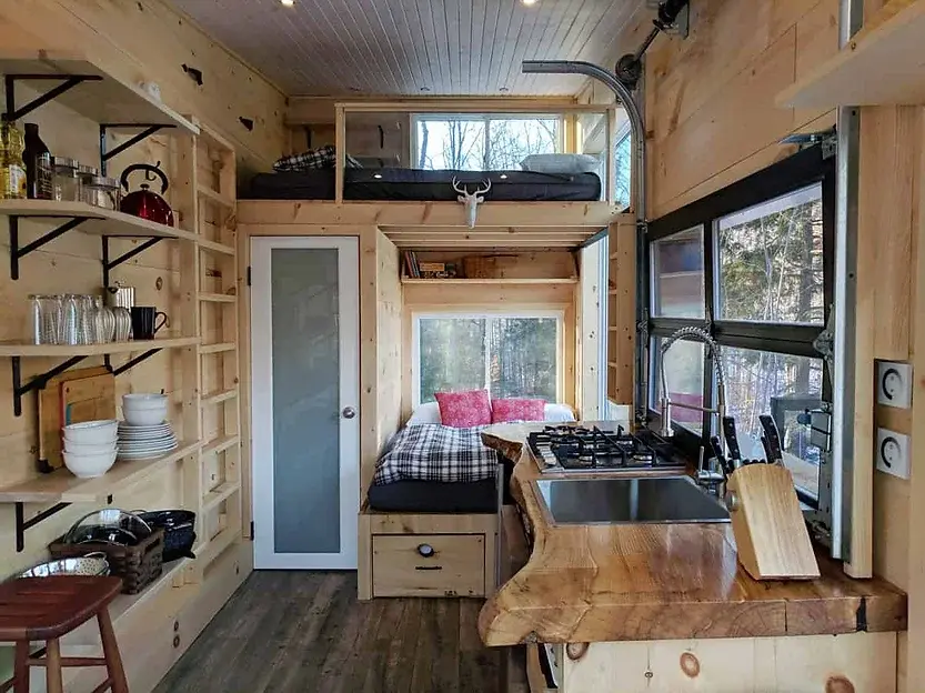 0490 Lovely off grid tiny house with dual bed design garage door window smallhometours.com 3