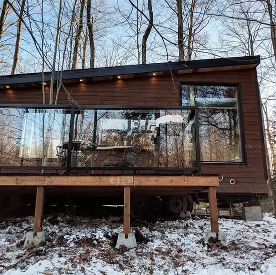 0490 Lovely off grid tiny house with dual bed design garage door window smallhometours.com 5
