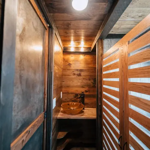 0533 Stunning 26 tiny house with crossfit workout gymnastics rings in living room smallhometours.com 10