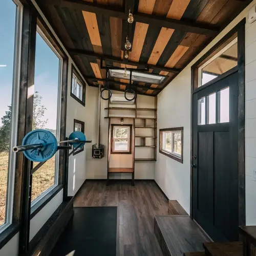 0533 Stunning 26 tiny house with crossfit workout gymnastics rings in living room smallhometours.com 14