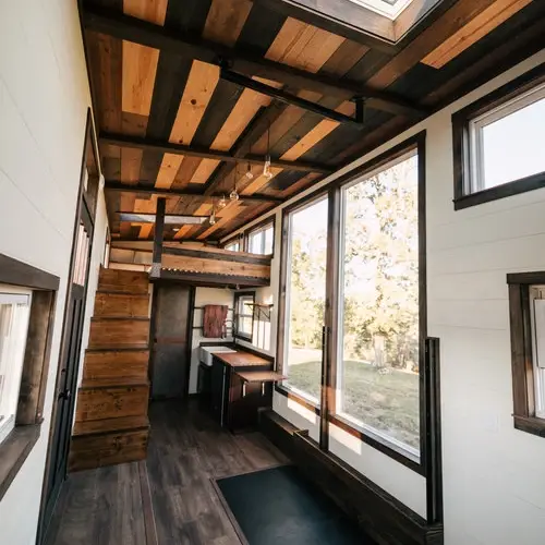 0533 Stunning 26 tiny house with crossfit workout gymnastics rings in living room smallhometours.com 4