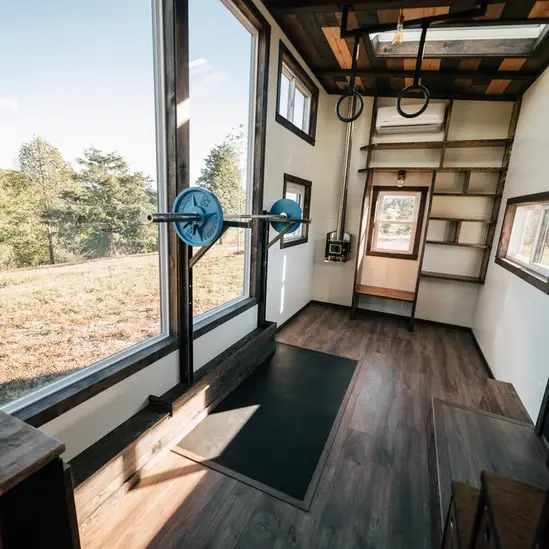0533 Stunning 26 tiny house with crossfit workout gymnastics rings in living room smallhometours.com 5