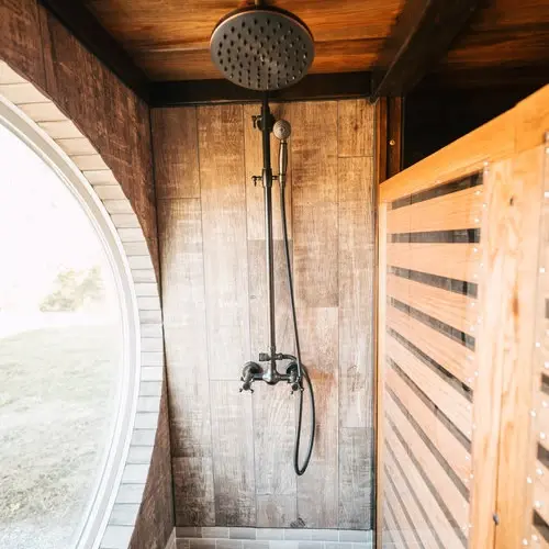 0533 Stunning 26 tiny house with crossfit workout gymnastics rings in living room smallhometours.com 6