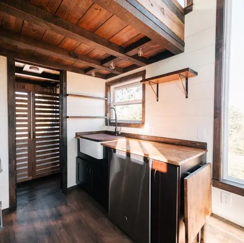 0533 Stunning 26 tiny house with crossfit workout gymnastics rings in living room smallhometours.com 7
