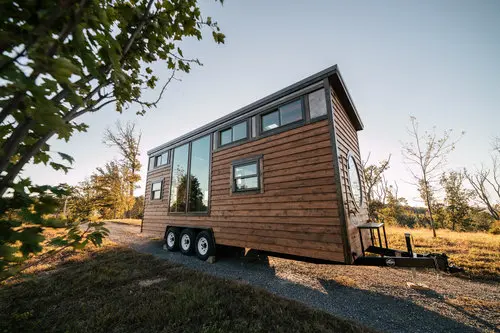 0533 Stunning 26 tiny house with crossfit workout gymnastics rings in living room smallhometours.com 9