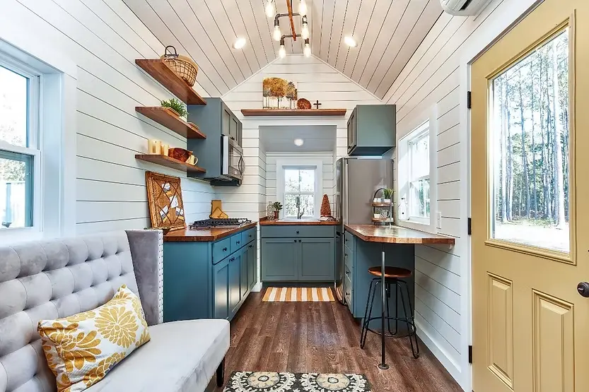 0543 A modern tiny house with open design a sleeping loft full kitchen and spacious bathroom smallhometours.com 2