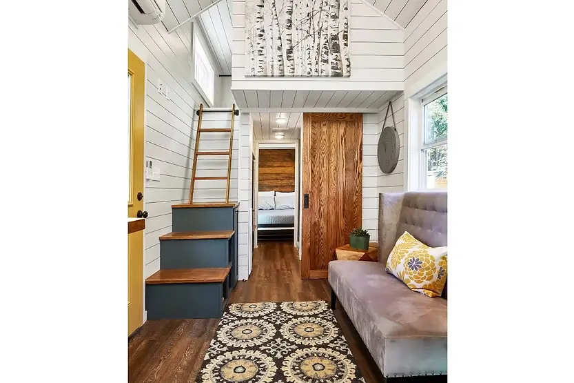 0543 A modern tiny house with open design a sleeping loft full kitchen and spacious bathroom smallhometours.com 3