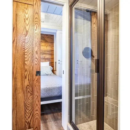 0543 A modern tiny house with open design a sleeping loft full kitchen and spacious bathroom smallhometours.com 5