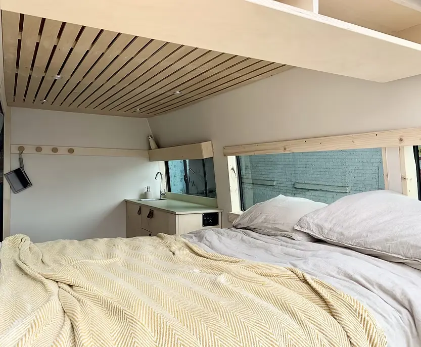 0576 Beautiful Ford transit campervan with organic spaces functionality and simplistic living smallhometours.com 4