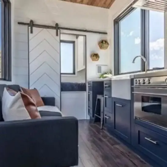 0595 Gorgeous tiny house with fold down porch and a bedroom on the main floor smallhometours.com 1