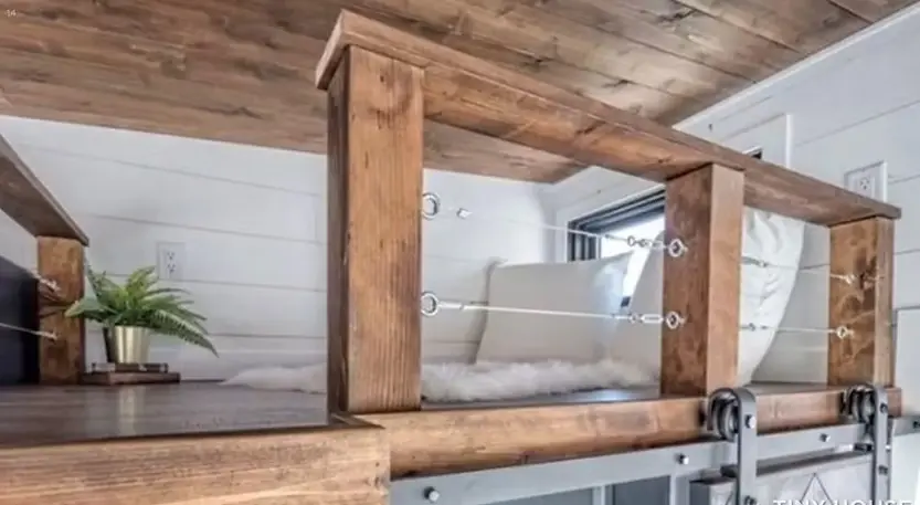 0595 Gorgeous tiny house with fold down porch and a bedroom on the main floor smallhometours.com 10
