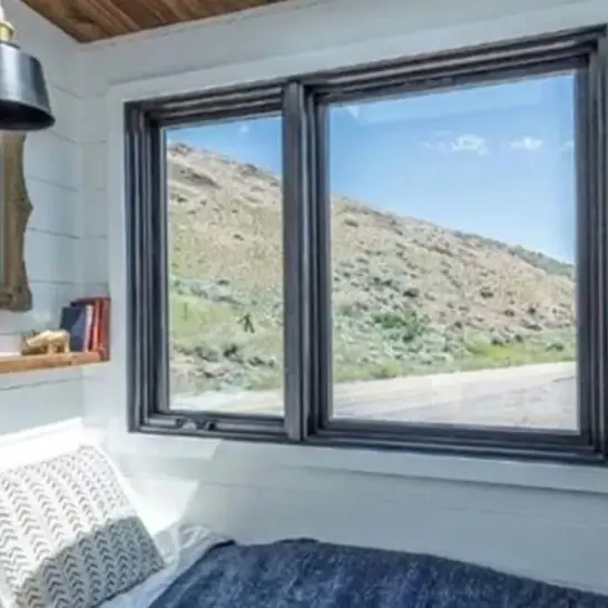 0595 Gorgeous tiny house with fold down porch and a bedroom on the main floor smallhometours.com 3