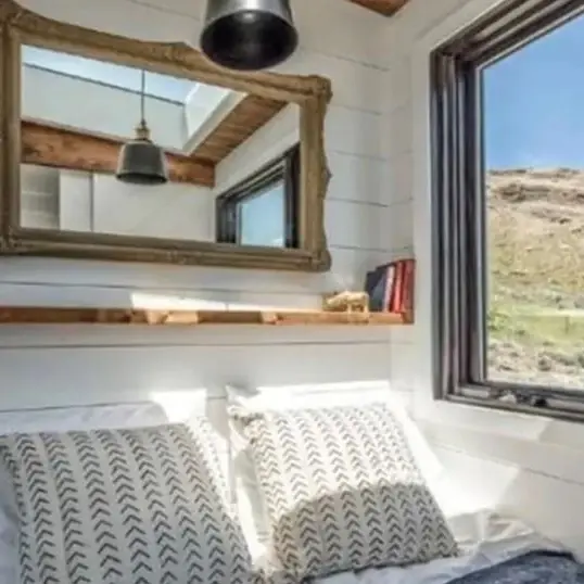 0595 Gorgeous tiny house with fold down porch and a bedroom on the main floor smallhometours.com 7
