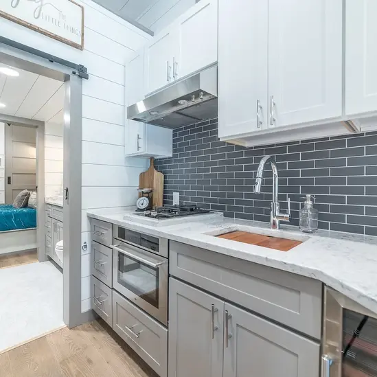 0601 Gorgeous 32 tiny house with 2′ extension on the rear making it 34′ over its entirety smallhometours.com 5