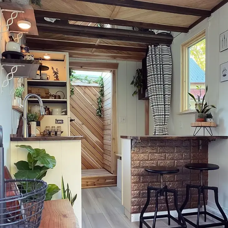 0603 Super cozy tiny home with skylit shower skylit loft bedroom smallhometours.com 10