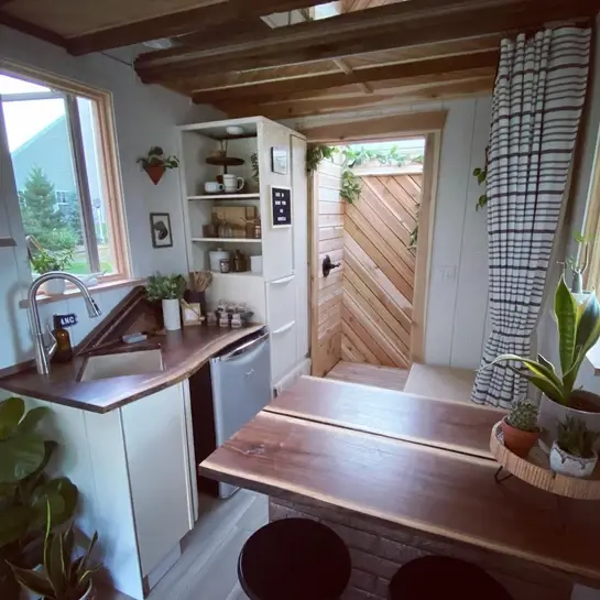 0603 Super cozy tiny home with skylit shower skylit loft bedroom smallhometours.com 3