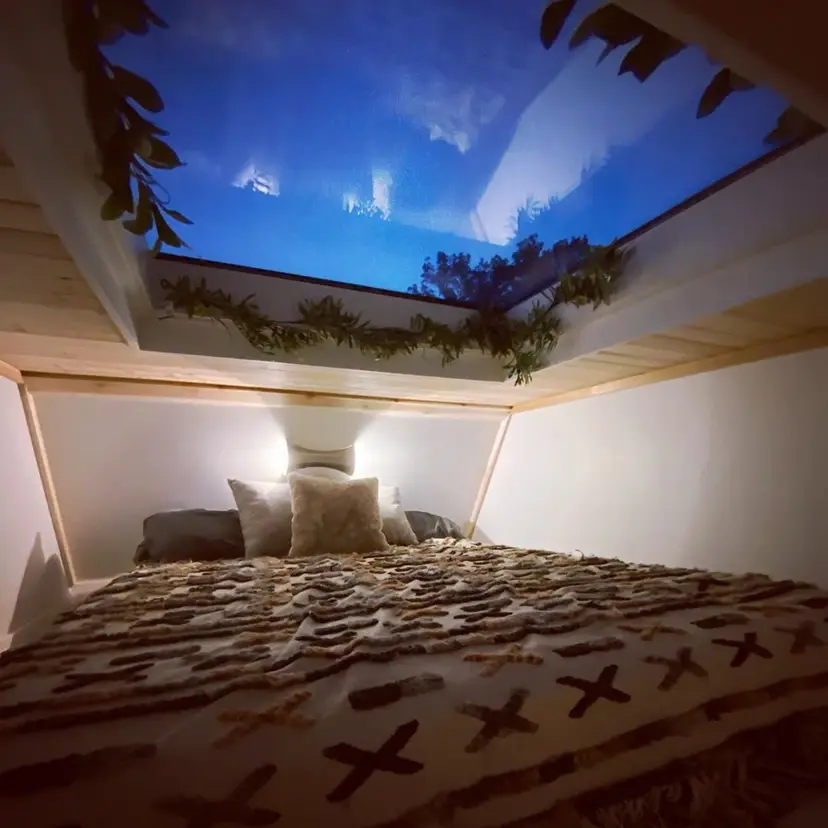 0603 Super cozy tiny home with skylit shower skylit loft bedroom smallhometours.com 7
