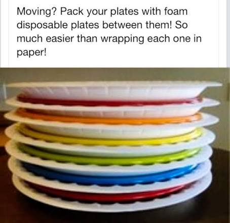 Stack of dishes with foam disposable plates placed between them as protective padding for moving.