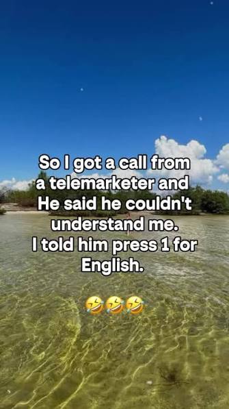 Tropical beach scene with text reading, “So I got a call from a telemarketer and he said he couldn't understand me. I told him press 1 for English,” followed by laughing emojis.